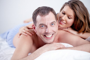 man and woman in bed